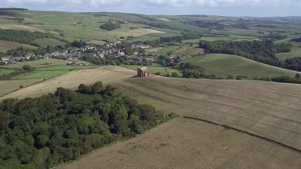 Very wide aerial of St Catherine's chapel in the vast surroundings of Dorset. Tracking and rotating