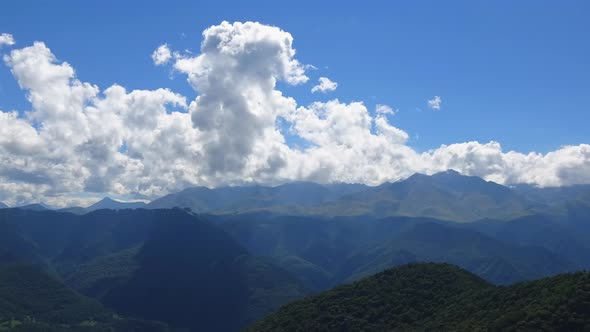 Timelapse in valley with beautiful clouds moving fast in national park of Dombay