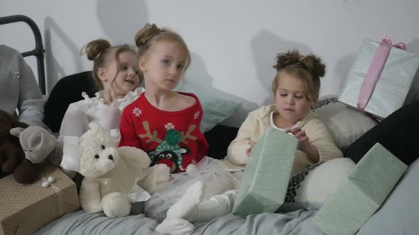 Adorable little children rejoice in the holy Christmas. Merry Christmas and Happy Holidays.