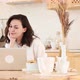 a Young Attractive Woman Sits at a Table in Her Kitchen and Talks Through a Video Conference - VideoHive Item for Sale