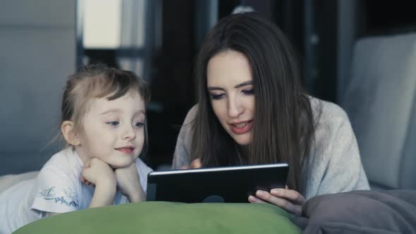 Happy Family Young Mum And Cute Little Kid Daughter Use Digital Tablet Technology Device 