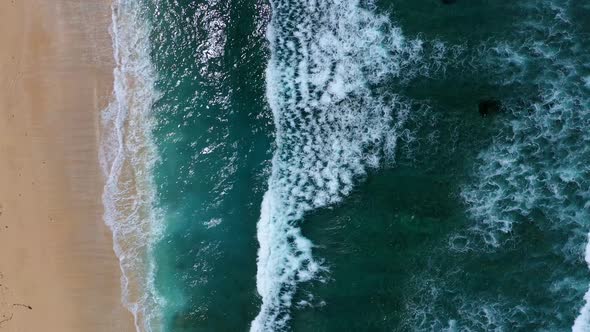 Waves and blue water as a background, View from drone at the ocean surface