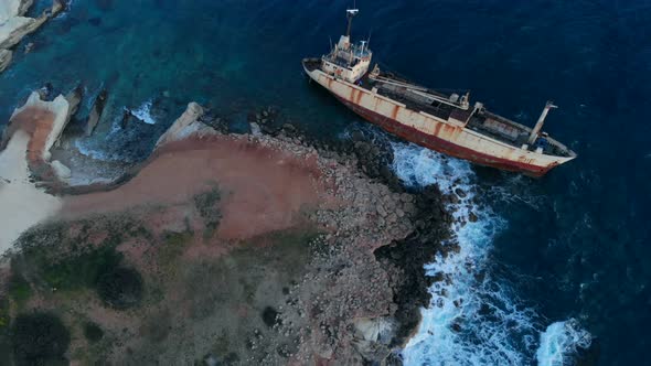 Aerial View of Shipwrecked Ship Lying Near Seashore