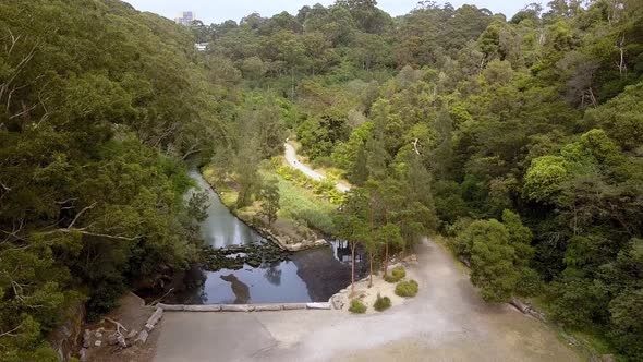 Aerial flyover of Flat Rock Creek canyon in Northbridge just past the Long Gully Bridge, Sydney Aust