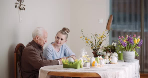 Woman Spending Time with Grandfather