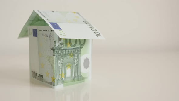 Hundread Euro banknotes house concept close-up 4K 2160p 30fps UHD tilting  footage - Real estate met