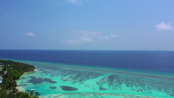 Aerial drone tourism of paradise shore beach voyage by blue sea and white sandy background of a dayo