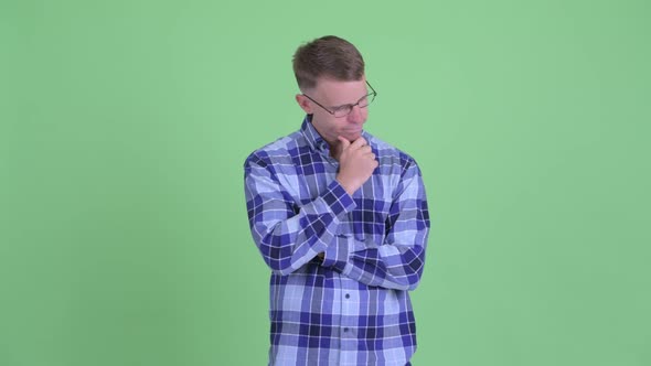 Portrait of Stressed Hipster Man Thinking and Looking Down