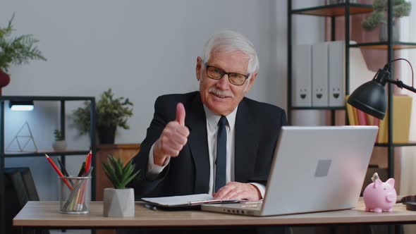 Senior Business Man Raises Thumbs Up Agrees Approve Likes Good News Using Laptop at Home Office