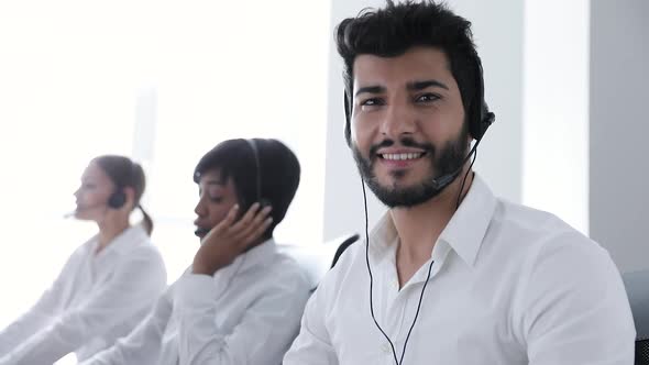Contact Center. Operator In Headset At Workplace Portrait