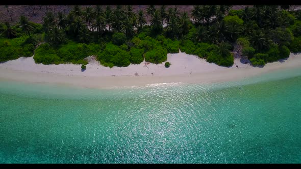 Aerial above landscape of marine coastline beach vacation by turquoise lagoon with white sand backgr