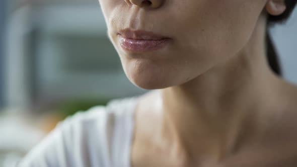 Lady Thoroughly Chewing and Swallowing Slice of Fresh Tomato, Close-Up Face