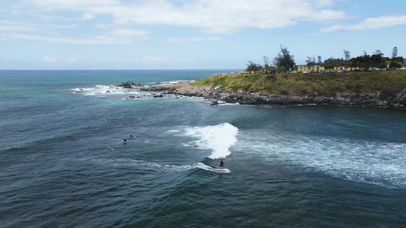 Surfer Catching and Riding a Wave at Local Surf Spot on Hawaii Island of Maui, Aerial