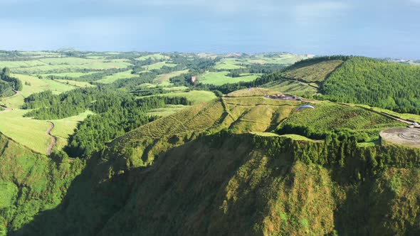 Paragliders Flying Over Green Landscape at Miradouro Do Cerrado Das Freiras