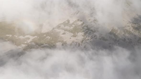 Scenic aerial view of moving white clouds at Abuli Mountain. Georgia