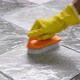 Cleaning the tiled floor with a plastic floor scrubber. - VideoHive Item for Sale