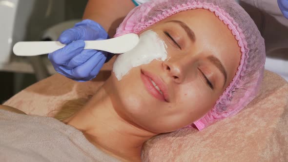 Happy Woman Getting Facial Treatment at the Beauty Clinic 1080p