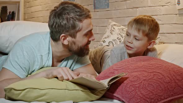 Father and Son Reading Bedtime Story