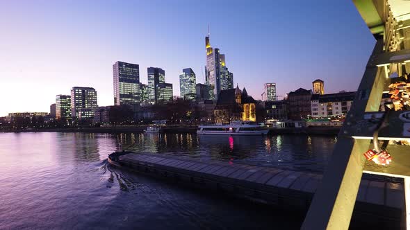 Germany, Frankfurt, Financial District and cargo ship on Main river