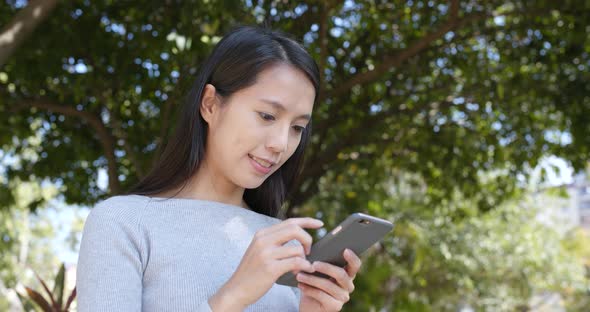 Woman Using Smart Phone at Outdoor