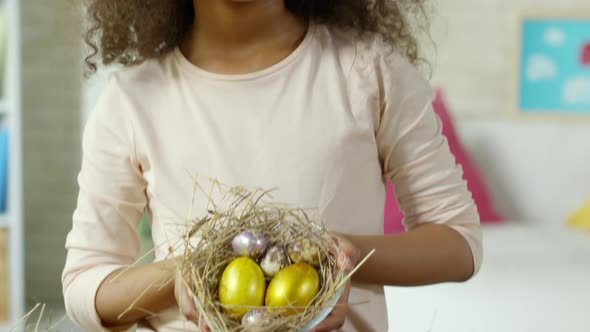 Cute African Girl Smiling and Posing with Easter Eggs