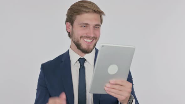 Video Call on Tablet By Young Businessman on White Background