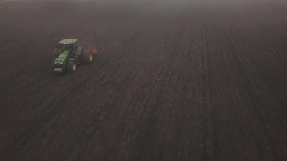 Tractor Plows a Field