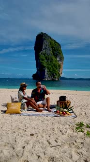 Koh Poda Krabi Thailand Asian Woman and European Men Having a Picnic on the Tropical Beach of Koh