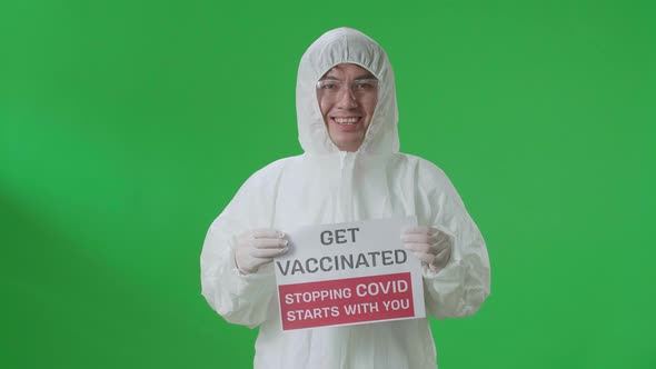 Asian Man Wearing Protective Uniform Ppe And Holding Get Vaccinated Stopping Covid Starts With You