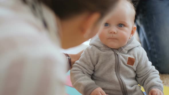 Young Lady Talking To Baby