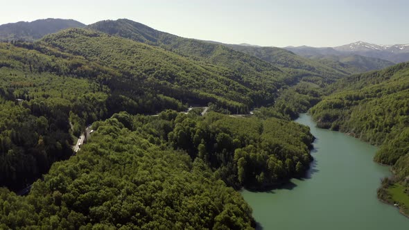 Lush Green Forests And Mountainous Topography Of Prahova County, Romania - aerial shot