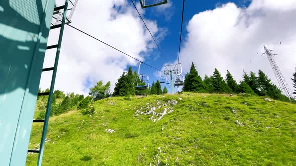 Chairlift Among the Alps in Summer Season