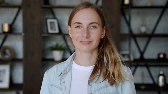 Smiling Young Adult European Woman Looking at Camera Standing at Home Office. 