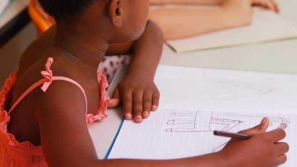 Schoolgirl doing her homework alt