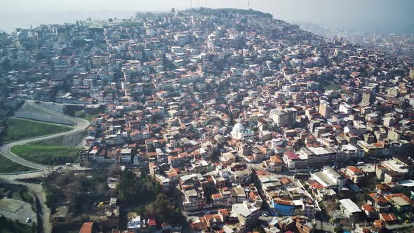 Drone view on poverty slum district and muslim mosque