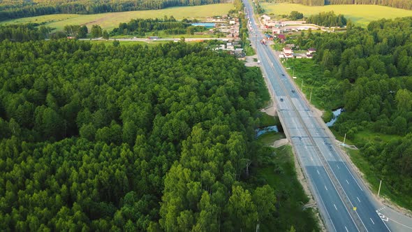 Aerial View of a Fourlane Country Road with Moving Cars