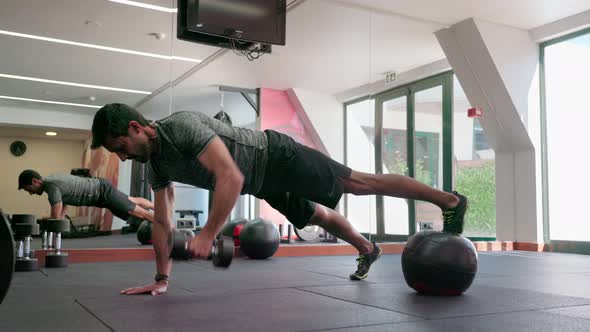 A Middleaged Man Performs Exercises for the Functionality of the Body and Endurance