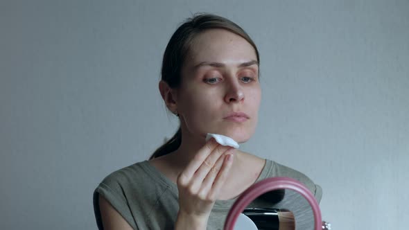 Woman Takes Care of the Skin at Morning