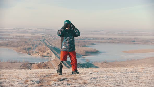 Man with Prosthetic Leg  on  Snowboard