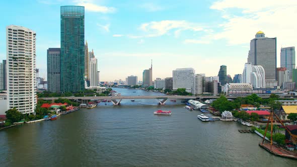 4K : Drones fly over the Chao Phraya River, buildings and business districts in Bangkok