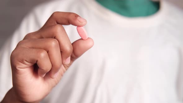 Close Up of Man Hand Holding Pills with Copy Space