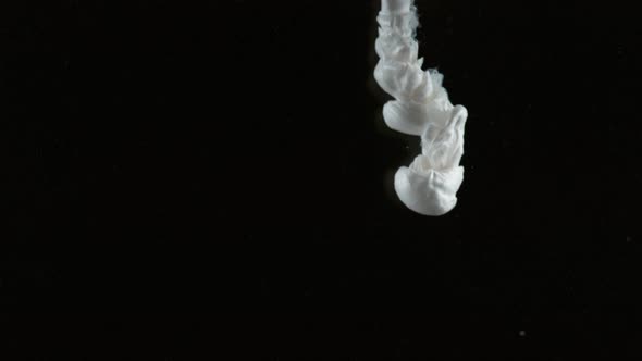 Slow motion shot of white ink on black background, shot with Phantom Flex 4K camera. alt