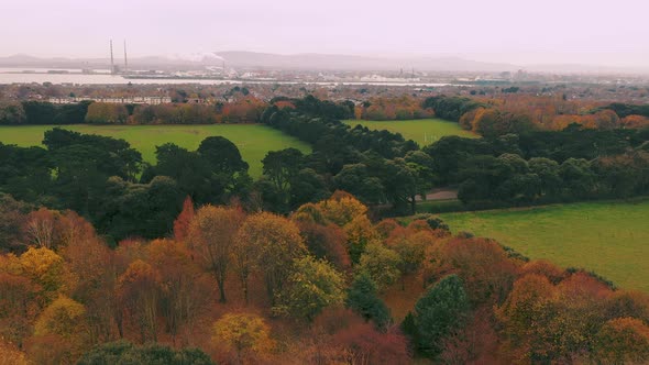 Cinematic aerial view above Saint Anne's Park in Dublin.