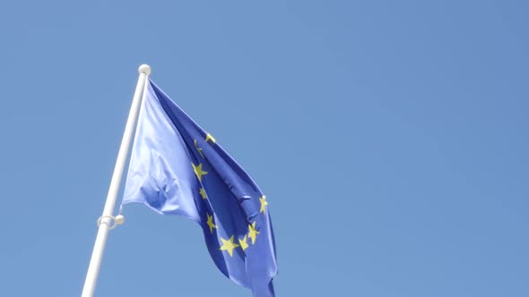 Slow motion European Union flag on the wind waving 1080p FullHD footage - EU flag fabric flowing out