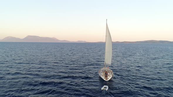 Aerial view of a sailboat anchored in the mediterranean sea, Vathi, Greece.