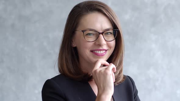 Portrait of Young Business Woman Isolated on Gray