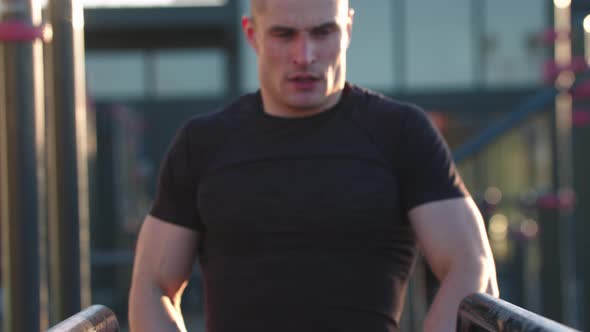 Young Sportive Handsome Man on Sports Ground  Looking in the Camera