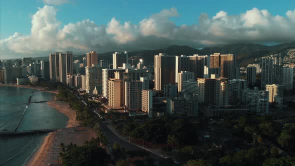 Aerial drone footage of Honolulu, Hawaii. Beautiful real estate, buildings in the city. Palm trees