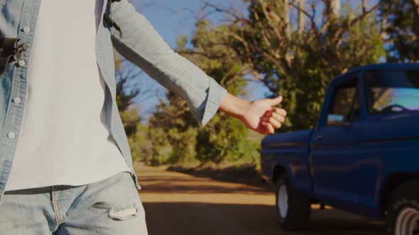 Young man on a trek in countryside