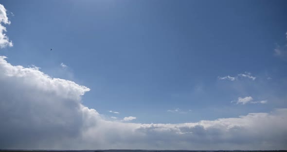 Light Balls Of Clouds Float Across The Sky